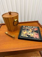 ice bucket with lid and closed bar set box on wooden surface