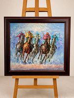 Full view of framed oil painting on easel