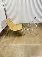 Both chairs side by side, rattan chair left, empty frame right