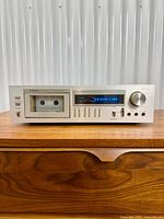 Front view of Pioneer CT-F555 cassette deck showing cassette well, level display, controls