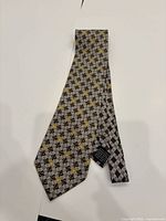 Front view of full tie showing geometric pattern and colour scheme