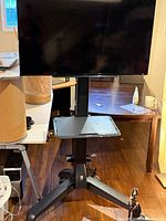 Front view of Sony TV mounted on mobile cart