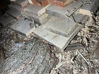 Stacked rough-cut ash boards showing thickness and rough surfaces