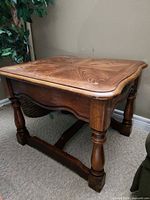 Full view of wood end table showing legs, apron and stretcher