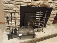Tool set, log holder, grate together in front of fireplace