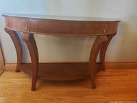 Full view of wood demi-lune hall table