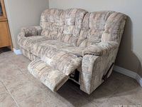 Sofa full view with left footrest extended