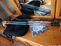 All items together: ObusForme back support, two walking sticks, cane, packaged bib