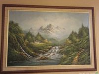 Front view of framed mountain landscape painting