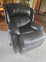 Front angled view of black faux leather recliner