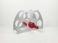Front angle of silver metal wine rack showing bottle inserted to demonstrate fit