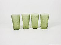 Four avocado green Pagoda tumblers side by side