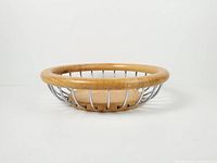 Side profile showing wood base, rim, and chrome spokes