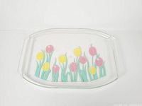 Full view of clear acrylic tray showing tulip design and handles