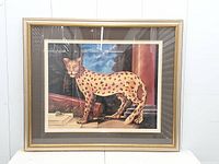 Front view of framed cheetah print showing full artwork, mat, and frame