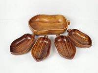 Front view of all five wooden bowls