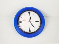 Front view of blue plastic quartz wall clock