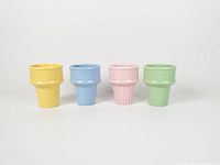 Front view of four pastel ceramic ice cream cone cups