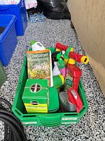 Overall view of one bin with assorted garden products and book