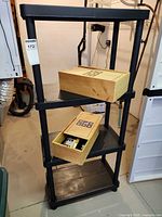 Shelving unit with two wooden boxes