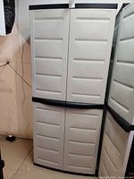 Front view of closed plastic cabinet