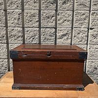 front view of wooden chest closed
