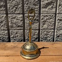 Full view of trophy standing on base