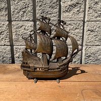 Full view of brass sailing ship lamp showing overall form and size
