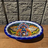 Top view showing full hand-painted design and blue rim