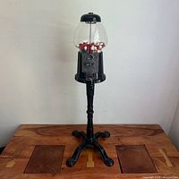 Full view gumball machine on stand