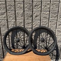 Both cast iron wheels side by side against wall