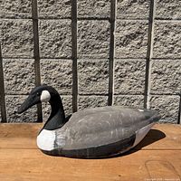 Left side view of the decoy on wooden surface