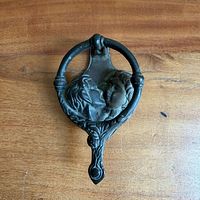 front view of door knocker showing full design