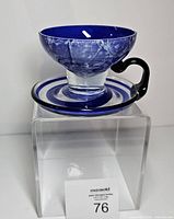 Front angled view showing full teacup and saucer