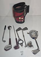 Full set: golf bag holder, bar tools laid out