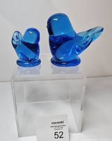 Adult and baby bluebird figurines front view on acrylic stand