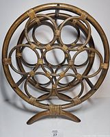 Front view showing circular rattan frame and compartments