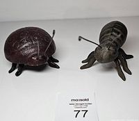 Ladybug and ant figurines front view with label 77