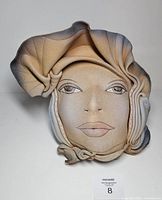 Front view of sculpted leather mask