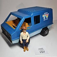 Blue Fisher-Price TV van and cowboy figure front left view