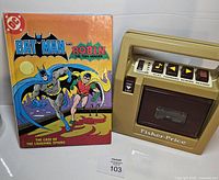Cassette player beside Batman read-along book