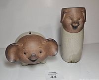 Front view of elephant coin bank and tumbler