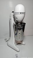 Front view of mixer with stainless cup attached