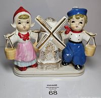 Front view of ceramic Dutch couple and windmill on oval base