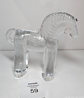 Front view of clear glass horse figurine