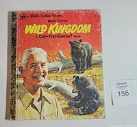 Front cover showing title, Marlin Perkins portrait, bear cub illustration