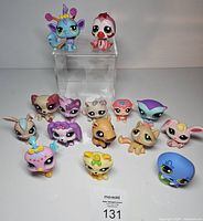 All fourteen Littlest Pet Shop figures displayed