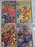 front covers of all four comics