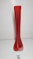 Front view of entire red glass vase