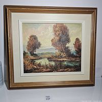 Front view of framed oil landscape painting